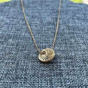 Shiny gold tone necklace spiral circle pendant